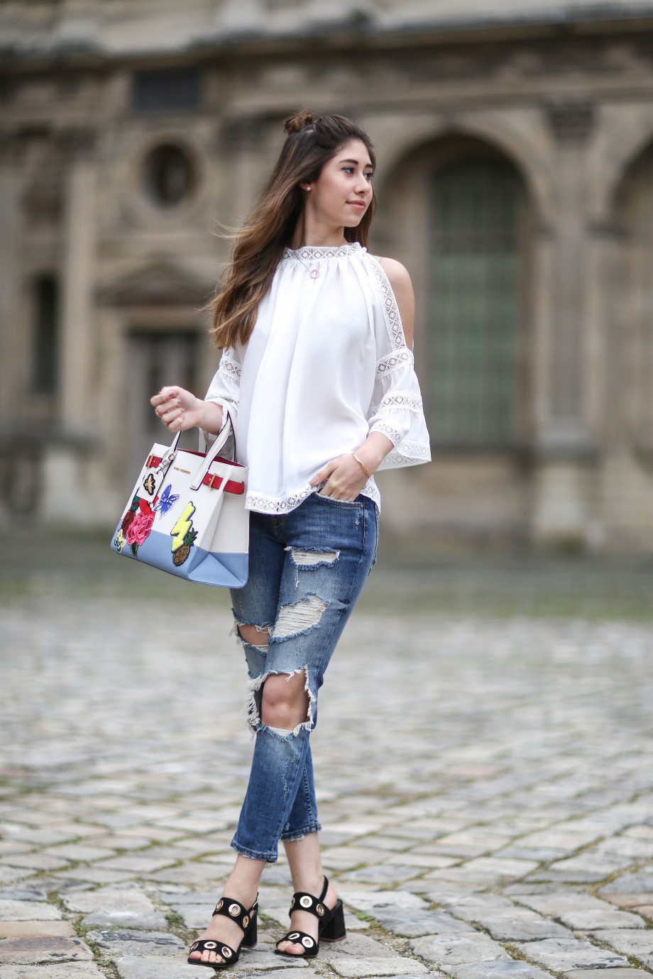 off the shoulder top, denim jeans and kurt geiger bag