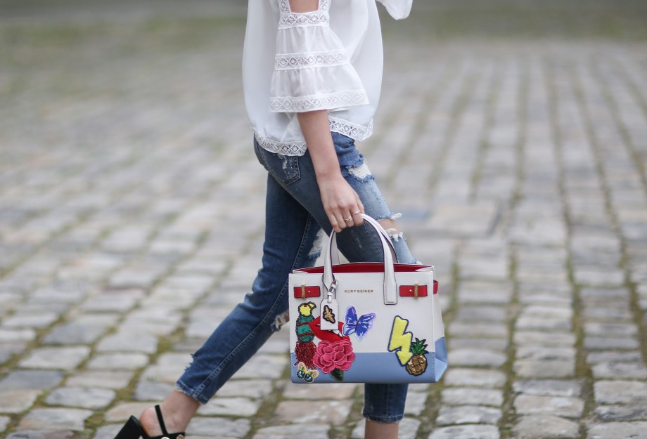 off the shoulder top, denim jeans and kurt geiger bag