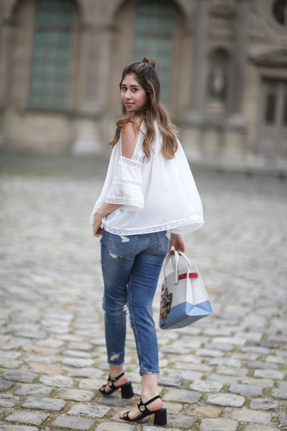 off the shoulder top, denim jeans and kurt geiger bag
