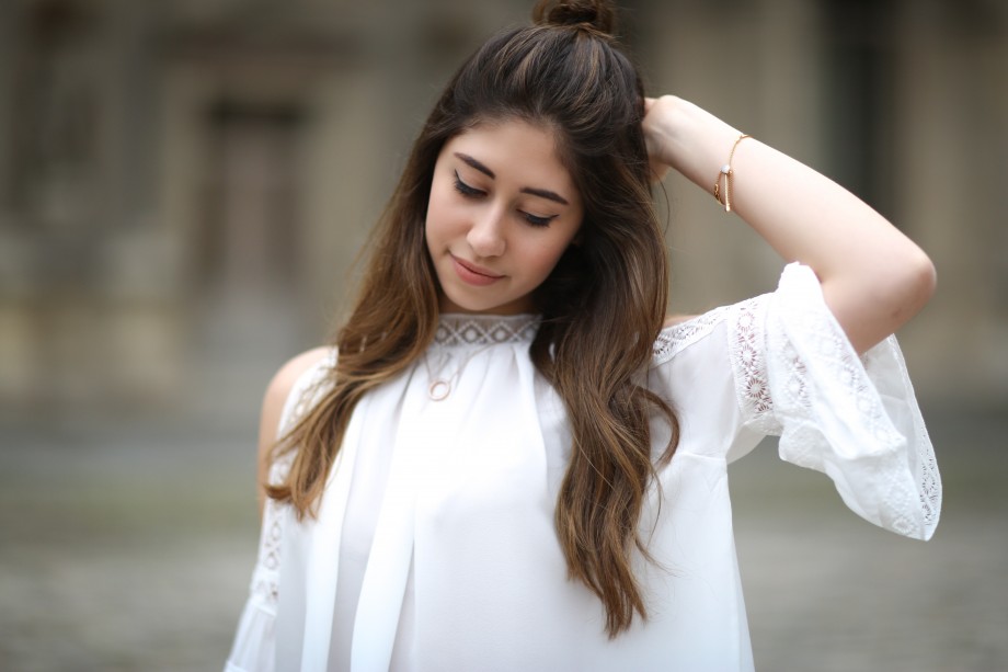 off the shoulder top, denim jeans and kurt geiger bag